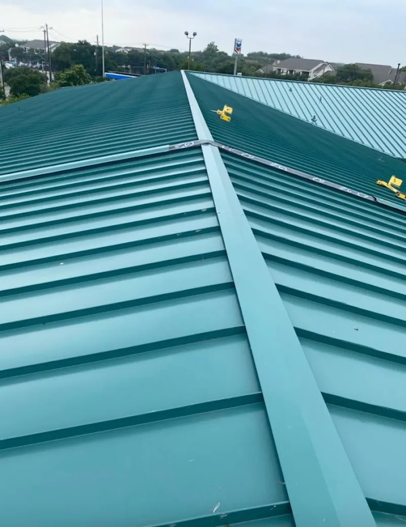 Green commercial metal roof ridge and valley for Metal Roof Repair in Honeygo